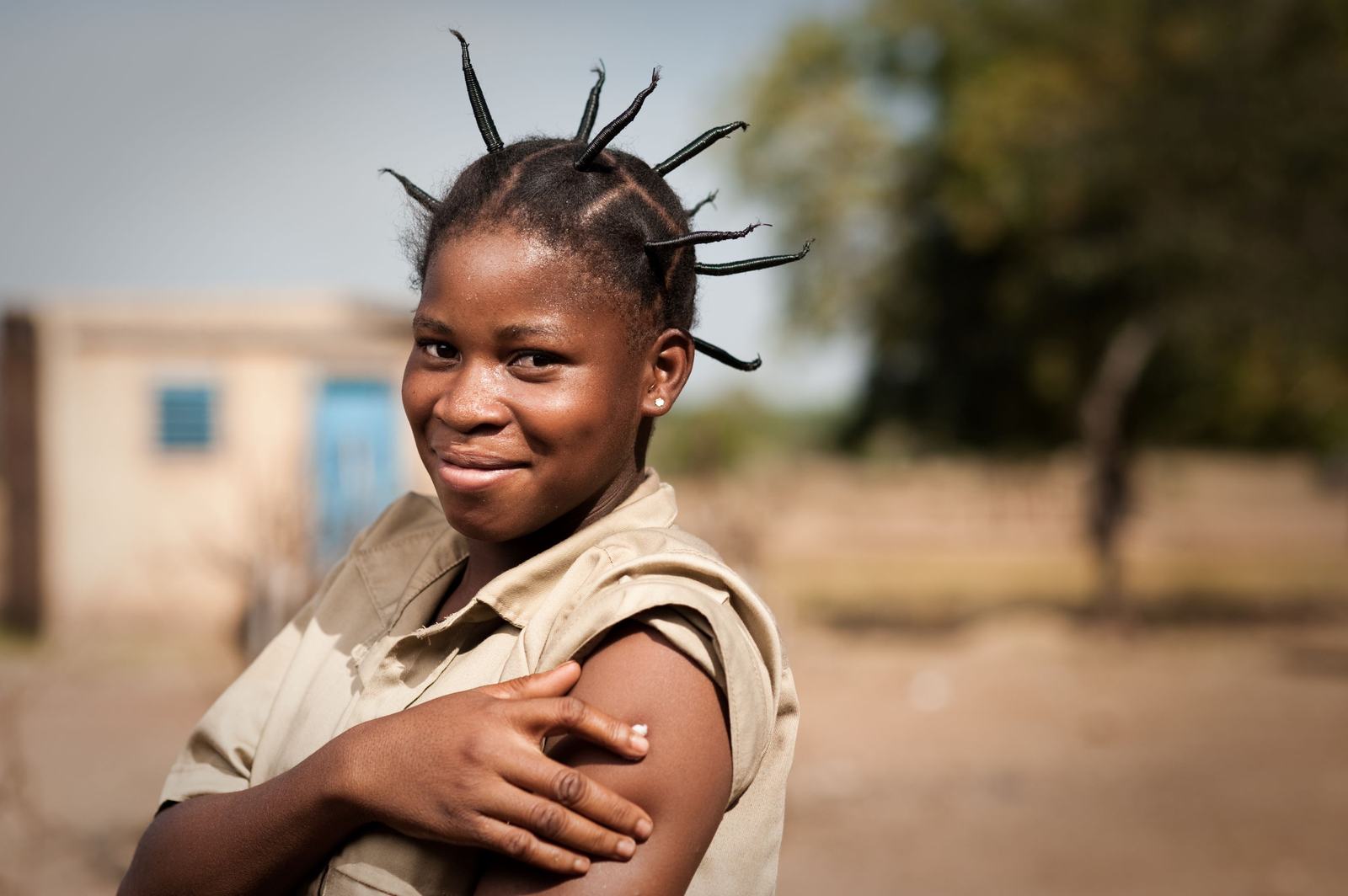 A young woman smiles after receiving a meningitis vaccine