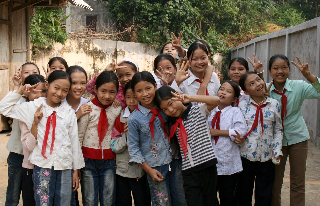 Group of children standing outside.