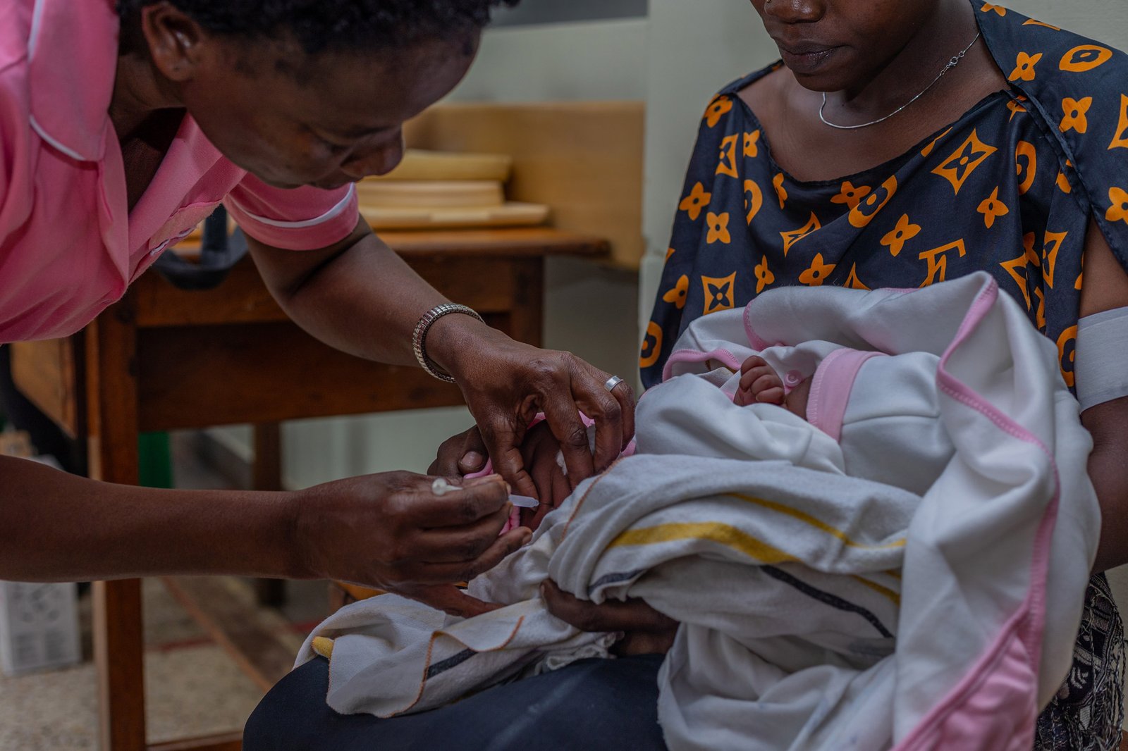 A health worker administers hepatitis B birth dose vaccine