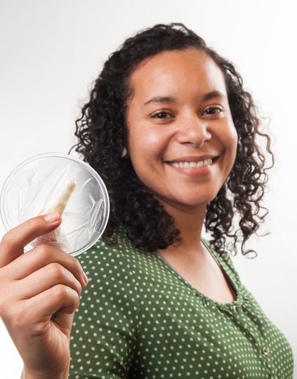 PATH staffer Cristina Butler holding a female condom. PATH/Patrick McKern.