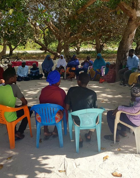 PATH staff leads a community discussion on malaria vaccines in Pebane District, Zambezia, Mozambique. Photo: Marçal Monteiro.