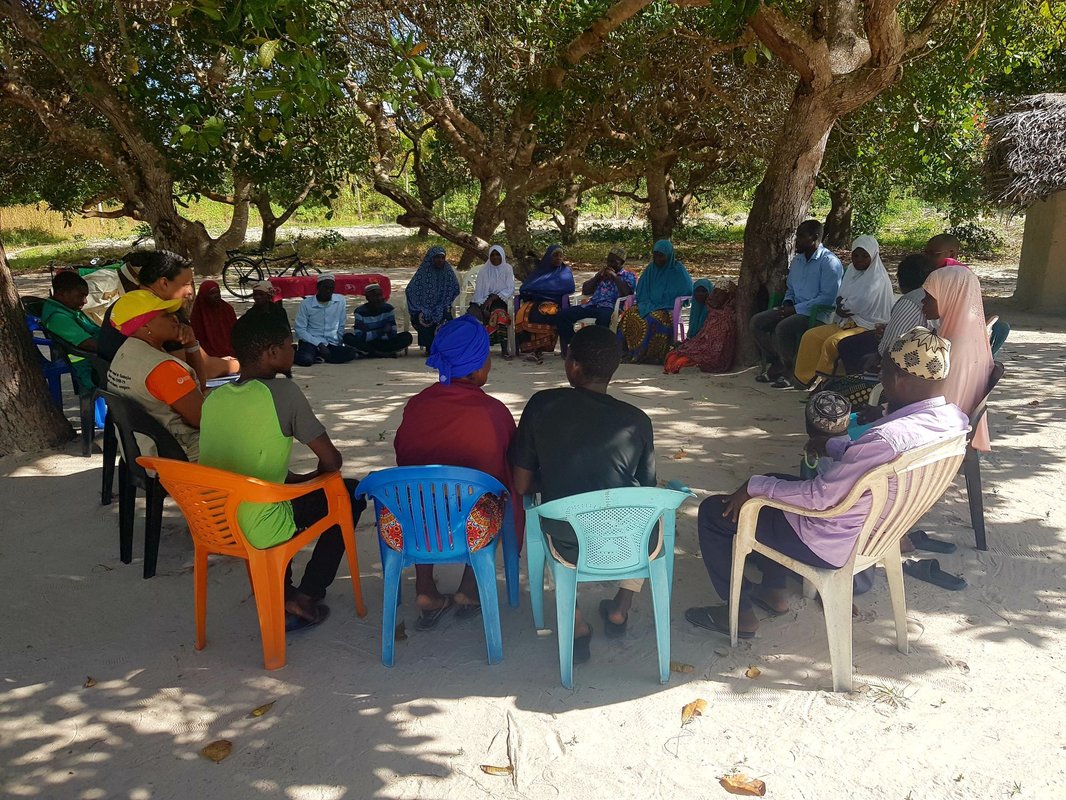 PATH staff leads a community discussion on malaria vaccines in Pebane District, Zambezia, Mozambique. Photo: Marçal Monteiro.