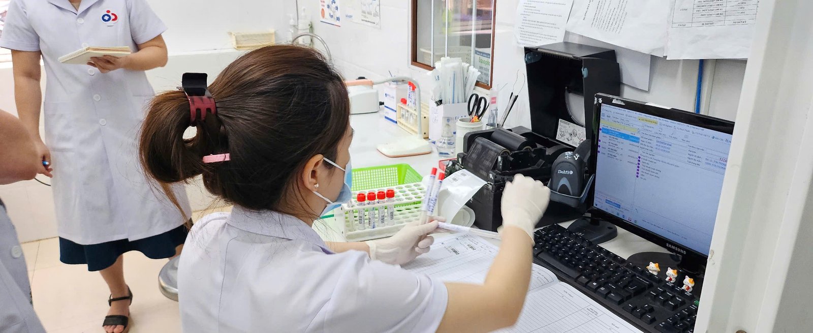 A laboratory technician reviews AMR data at a hospital in Vietnam. Photo PATH/Pham Huong Lien