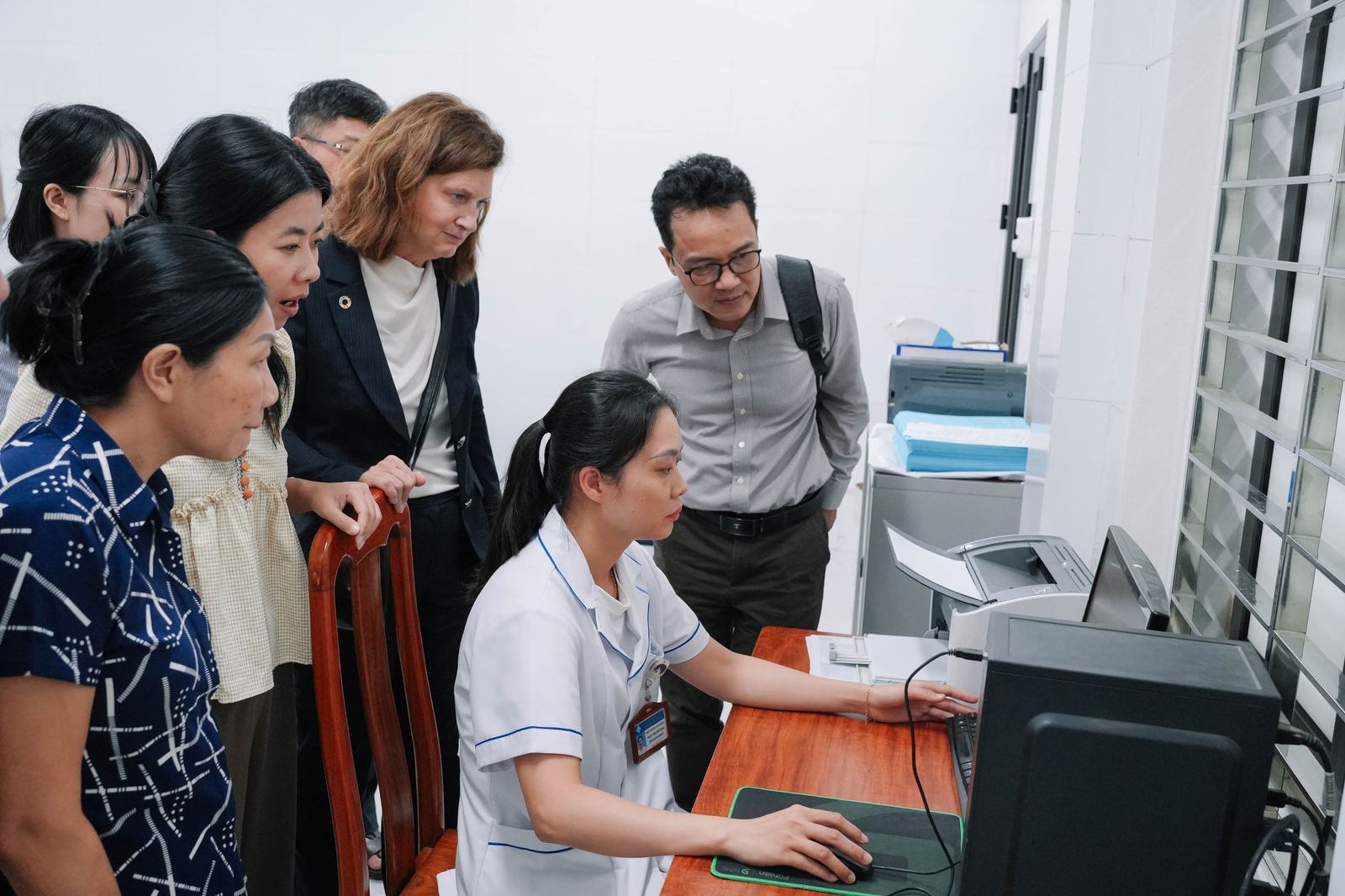 5. Health workers review patient data on cardiovascular and metabolic disorders using the Sức Sống Mới dashboard.
