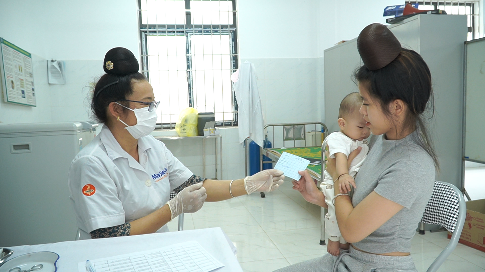 A health care worker in Son La province, Vietnam, vaccinates an infant at the local health facility.