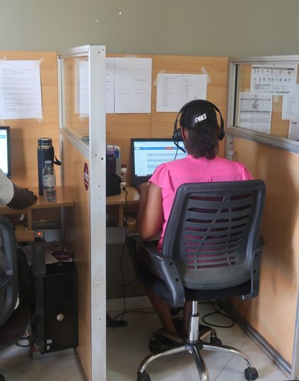 Agents at CDFU’s call center, which provides information, counseling and referrals on a variety of health topics in Uganda, respond to queries and conduct outbound calls. Photo: Joseph Waninda/PATH.