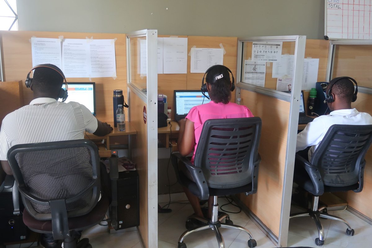 Agents at CDFU’s call center, which provides information, counseling and referrals on a variety of health topics in Uganda, respond to queries and conduct outbound calls. Photo: Joseph Waninda/PATH.