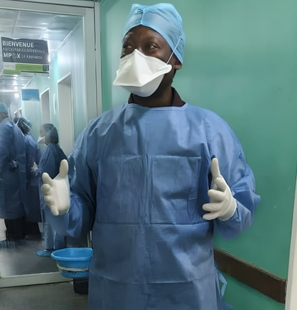 Dr. Albert Komba, SAFEStart+ project director stands in full personal protective gear inside the mpox isolation ward at Clinique Kinoise in Kinshasa, DRC