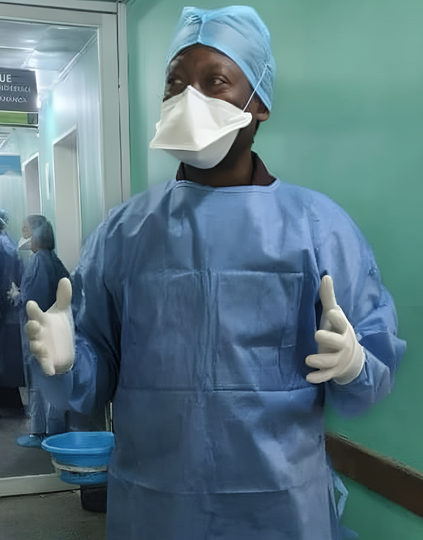 Dr. Albert Komba, SAFEStart+ project director stands in full personal protective gear inside the mpox isolation ward at Clinique Kinoise in Kinshasa, DRC