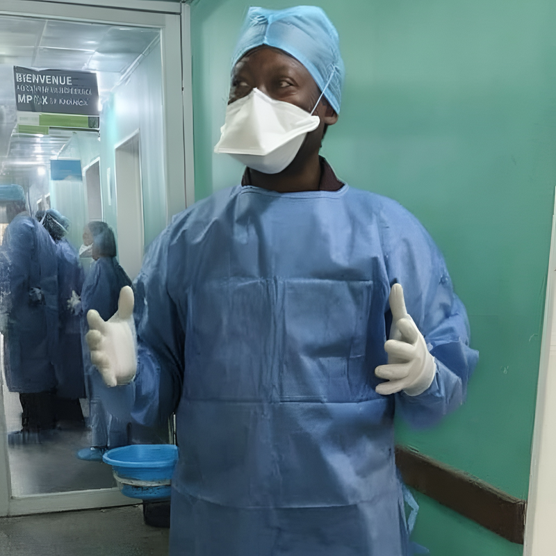 Dr. Albert Komba, SAFEStart+ project director stands in full personal protective gear inside the mpox isolation ward at Clinique Kinoise in Kinshasa, DRC