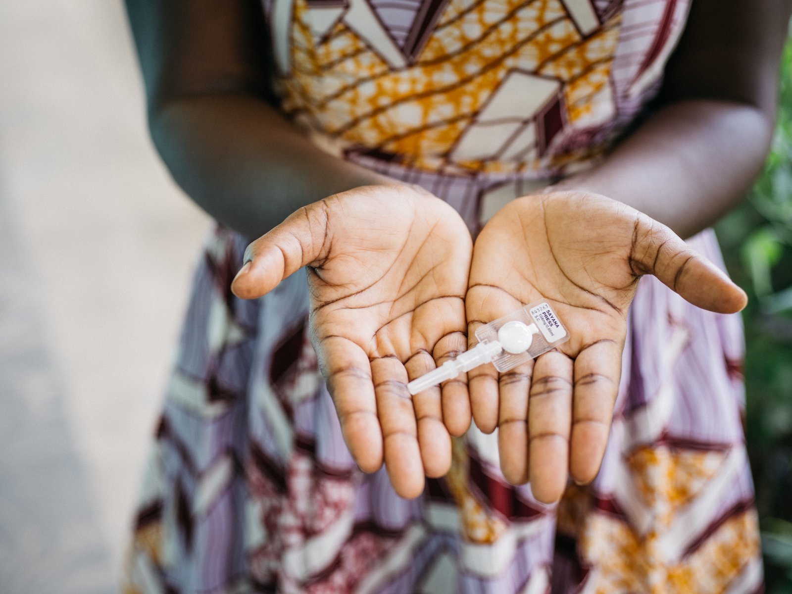 Woman holds subcutaneous DMPA (DMPA-SC, Sayana Press)