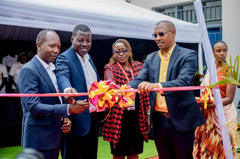 Dr. Francois Uwinkindi (RBC), Amos Mugisha, Margaret Kigwe (AstraZeneca), and Jean Leonard Sekanyange (Vice Mayor of Gatsibo District) cut the ribbon to mark the launch of the expanded HHA project in Rwanda. Photo: PATH/Kanyarwanda Arts.