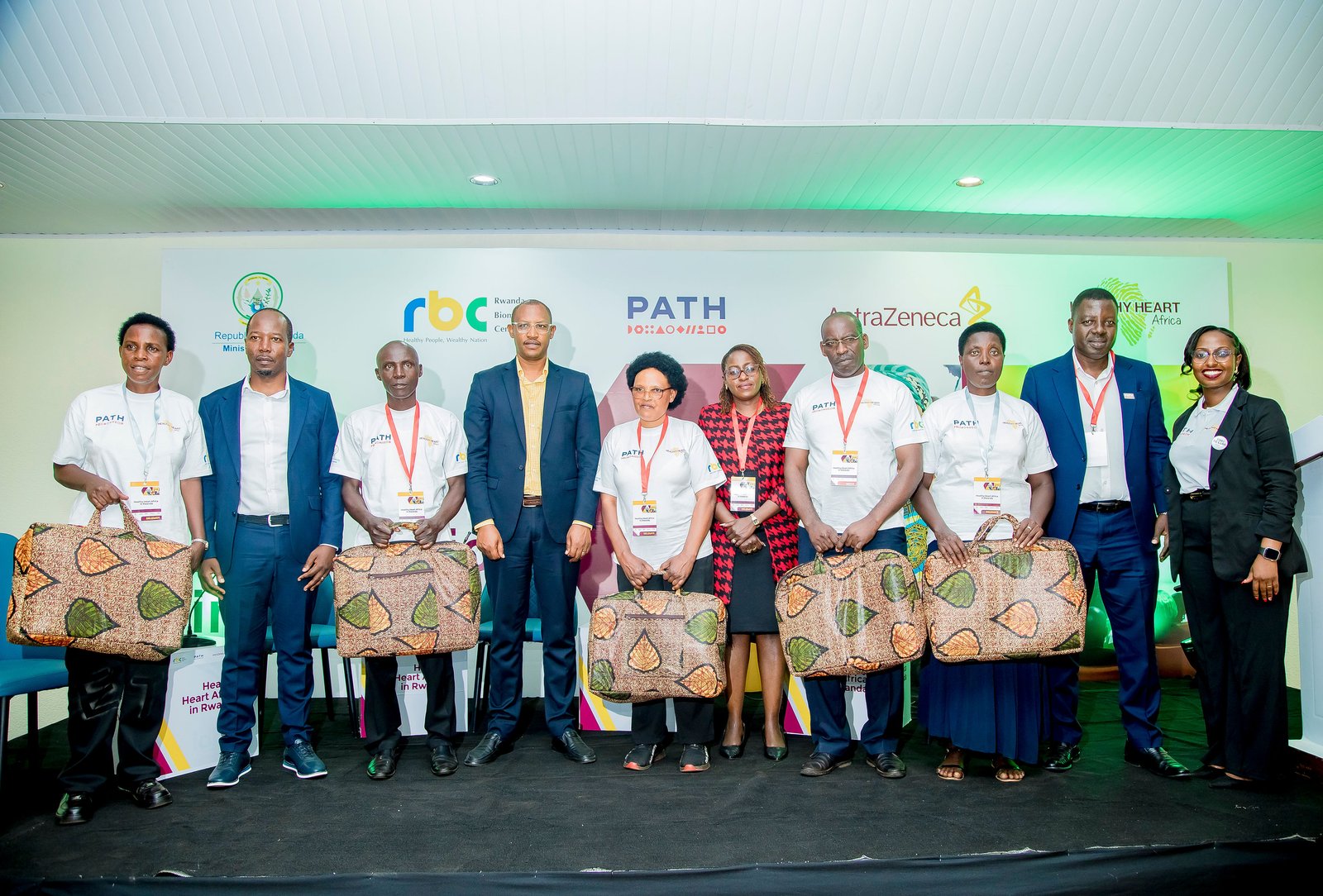 Community health care workers receiving kits that will support them in community-based screening for hypertension and diabetes. Photo: PATH/Kanyarwanda Arts.
