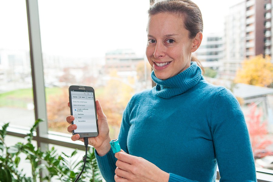 Dr. Amy Ginsburg holding a mobile phone.