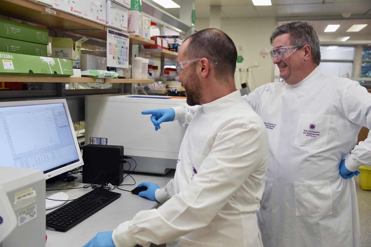 Dr. Christian Fercher and Professor David Owen review quality control data for a malaria antigen, part of PEF’s commitment to production of reliable, high-quality proteins supporting global malaria diagnostics. Source: AIBN UQ