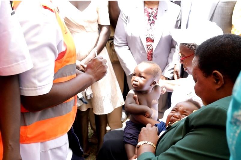 An infant receives the malaria vaccine with the Prime Minister of Uganda, Rt Hon Robinah Nabanja, on April 1, 2025, in Apac District. Credit: PATH.