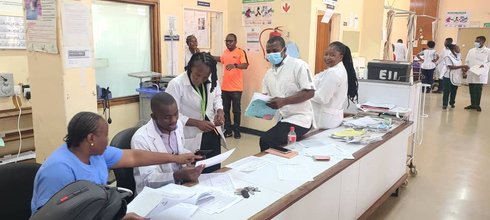 Health workers in Zambia review global point prevalence survey materials during data collection in October 2025. Point prevalence surveys can help understand prescribing practices and inform improved policies for antimicrobial use. Photo: PATH/Benjamin S