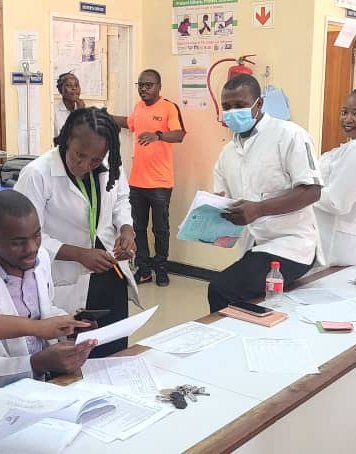 Health workers in Zambia review global point prevalence survey materials during data collection in October 2025. Point prevalence surveys can help understand prescribing practices and inform improved policies for antimicrobial use. Photo: PATH/Benjamin S