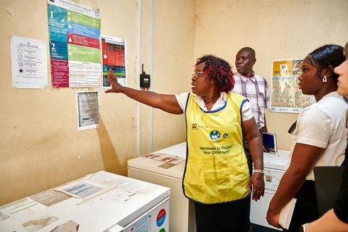 Victorine Wasonga (center) reviews with Fata Acquoi (right) the vaccine contingency plan at Chuowe Health Centre.