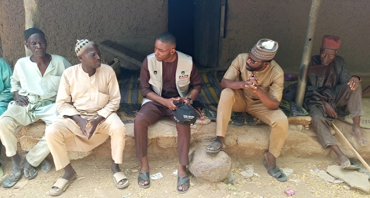 A PATH Program Officer engages with community leaders in Bauchi State, Nigeria, during a rapid assessment exercise following the introduction of the malaria vaccine.